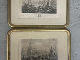two framed pictures of ships on a wall in a room