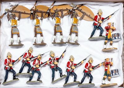many figurines of soldiers in a display case