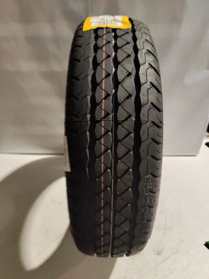 a close up of a tire on display on a table