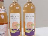 three bottles of wine sitting on a table next to each other