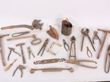 a lot of old tools that are on a table