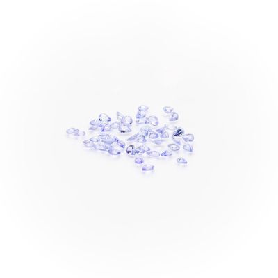 a pile of purple and white crystals on a white surface