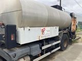 a large tanker truck parked on the side of the road