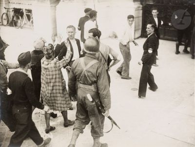 a group of people that are standing around in the street