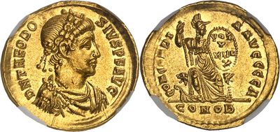 a gold coin with an image of a woman on it