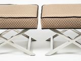 pair of chrome stools with upholstered cushions and matching foot stools