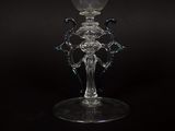 a glass vase that is sitting on a black table