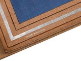 a picture of a brown and blue book on a table