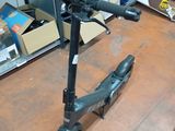 a scooter that is sitting on the floor in a room