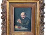 tableau représentant un vieil homme tenant un verre de vin, dans un cadre doré