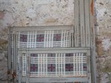 a couch and a chair in front of a stone wall