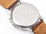 an image of a close up of a watch on a white surface