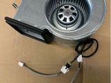 a close up of a fan on a cardboard box with wires