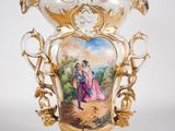 a vase with a picture of a man and a woman on it
