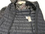 the jacket is black and has a checkered collar on it