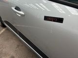a car with a sticker on the door of it