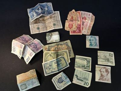 a lot of money sitting on a black table