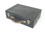 a black suitcase that is sitting on a white surface