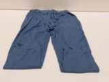 blue pants with pockets on a white surface with a white background