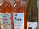 several bottles of wine are lined up on a table