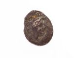 une image d'une pièce de monnaie sur laquelle figure un visage