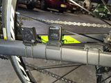 a cell phone attached to the back of a bike