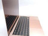 a close up of a laptop on a white surface
