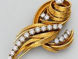 an image of a gold and diamond broochle