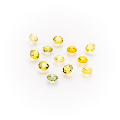 a group of yellow sapphires on a white background