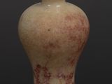 an old vase with a wooden lid sitting on a table