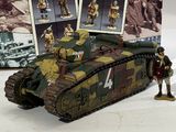 a picture of a toy army tank with soldiers on it