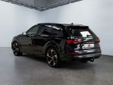 the rear end of a black audi suv parked in a garage