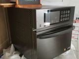 two ovens stacked on top of each other on a counter