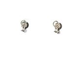 pair of silver earrings on a white background with a white background