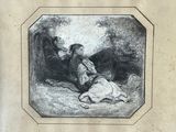 une vieille photo représentant un homme et une femme assis par terre