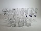 a lot of glasses that are sitting on a table