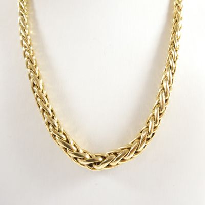 a gold necklace on a mannequin mannequin mannequin mannequin mannequin mannequin mannequin mannequin mannequin
