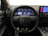 the interior of a car with a steering wheel, dashboard, and touch screen