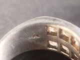 a close up view of a metal bowl with food inside of it