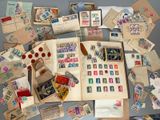a lot of stamps on the table with a teddy bear