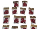 a lot of small bags of red flowers on a white surface