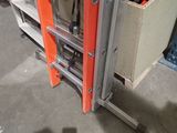 a ladder that is sitting in the middle of a room