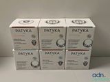 quatre boîtes de crème Patyka empilées les unes sur les autres
