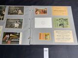 a folder with a lot of old postcards on it