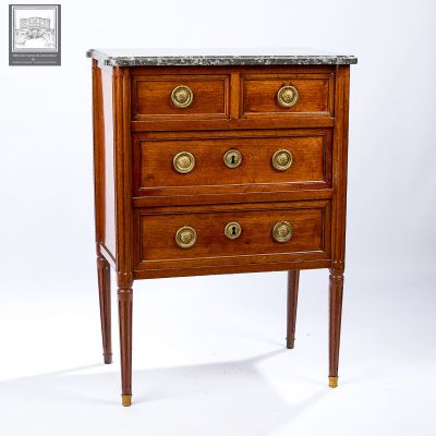 a small wooden chest of drawers with marble top