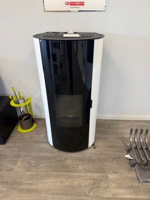 an image of a black and white stove in a living room