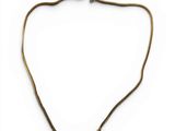 the necklace is made of brass and has a long chain