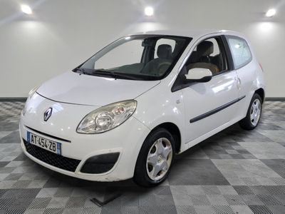 a picture of a small white car parked on a checkered floor