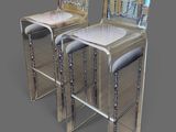 pair of mirrored bar stools in the shape of a pair of chairs