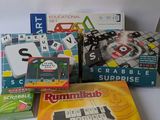 several board games are sitting on top of a white table